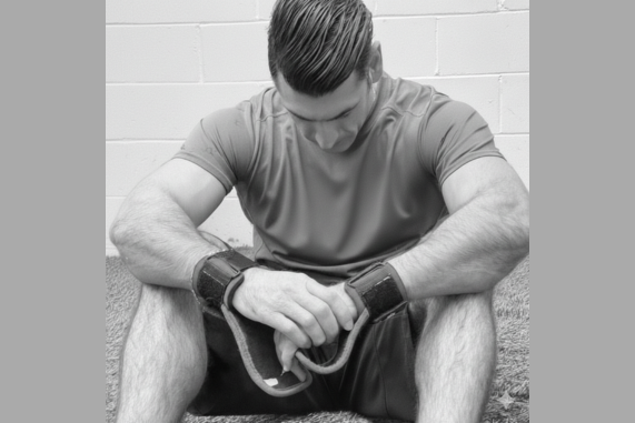 Stressed man holding jump rope